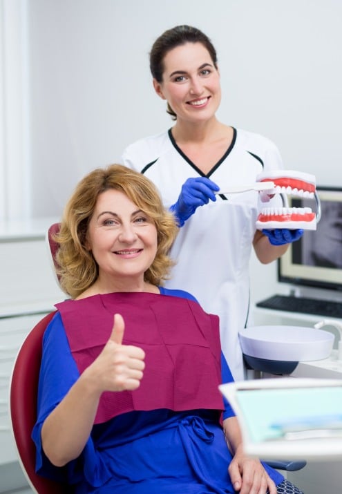 portrait cheerful mature woman patient dental clinic