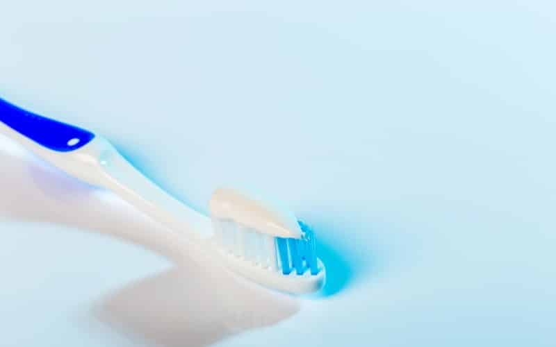close toothbrush blue background